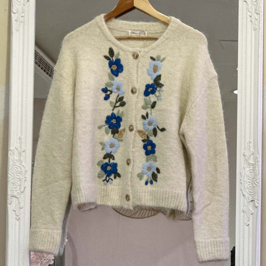 Gilet brodé avec fleurs bleues